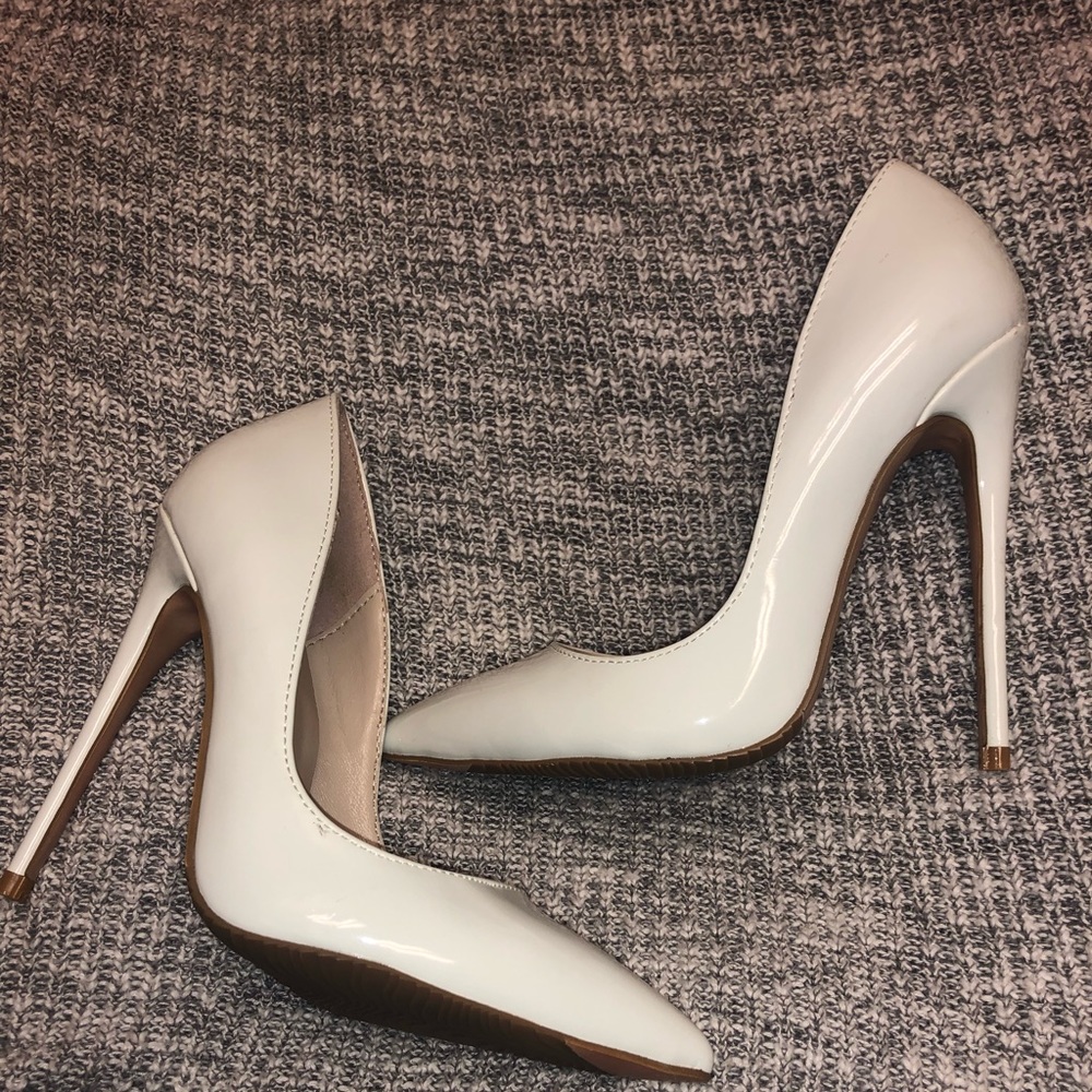 White pointed toe patent leather pumps